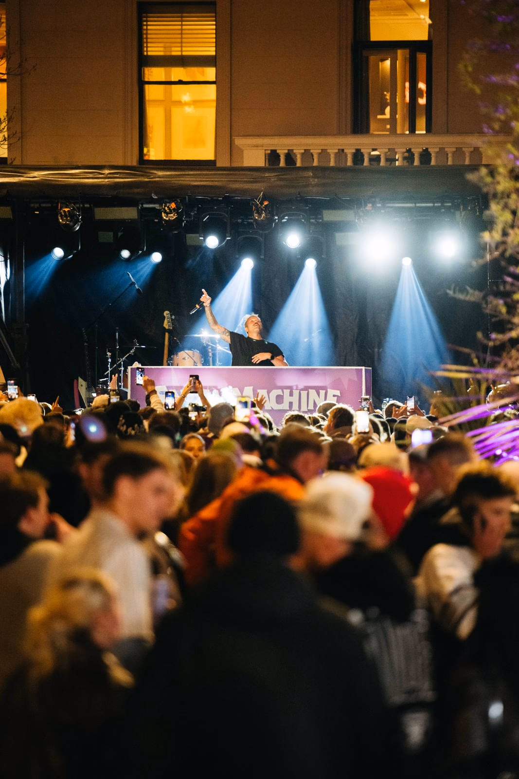 DJ performing on the night stage under the lights