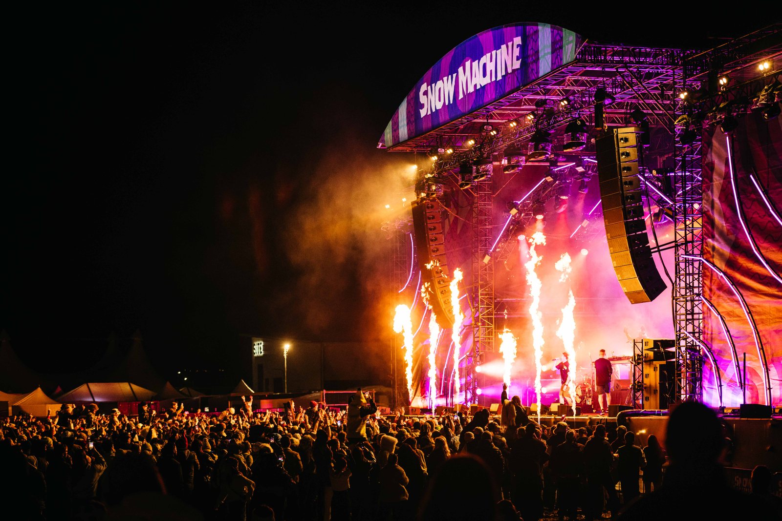 Night-time Main Arena stage lit with pyrotechnics