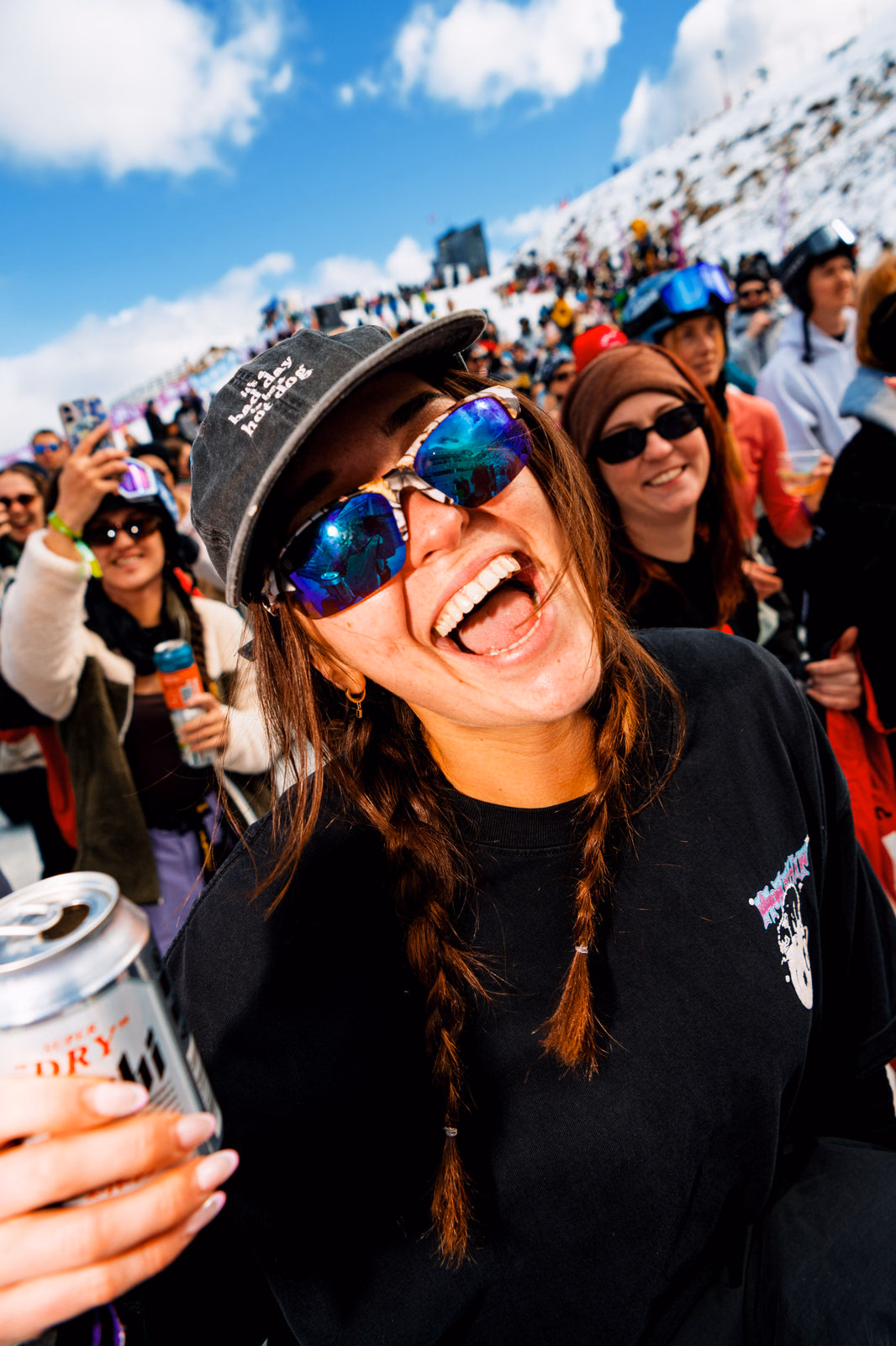 Young woman laughing at the ski resort gathering